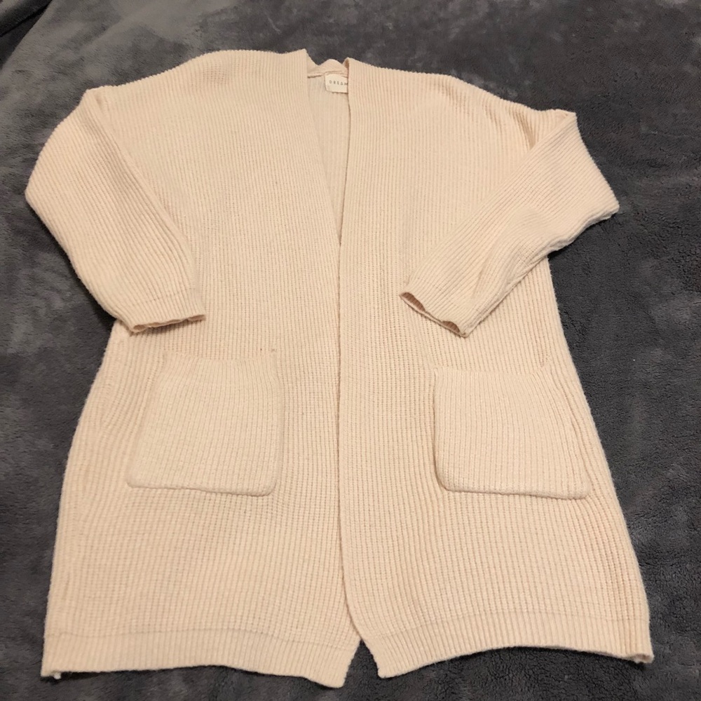 Cream color tunic cardigan with front pockets